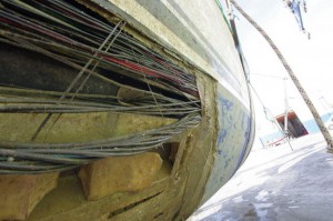Oyster 825 Hull laminate torn away showing exposed wiring